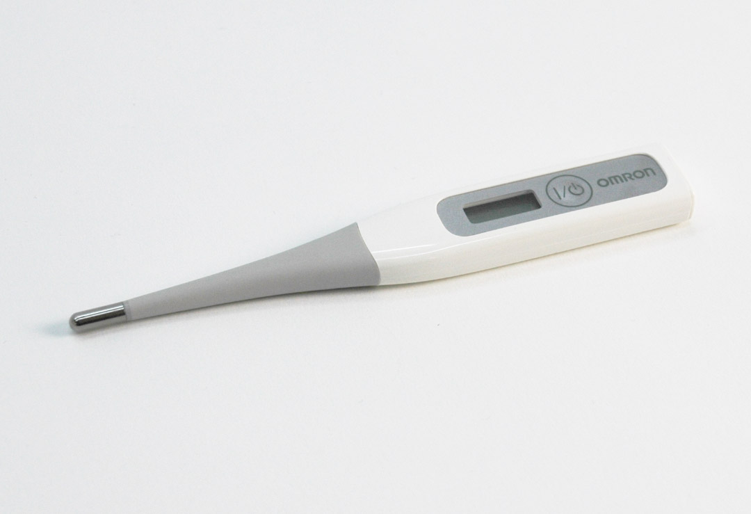 Precise digital Omron Flex Temp Smart clinical thermometer for oral, axillary or rectal fever measurement.