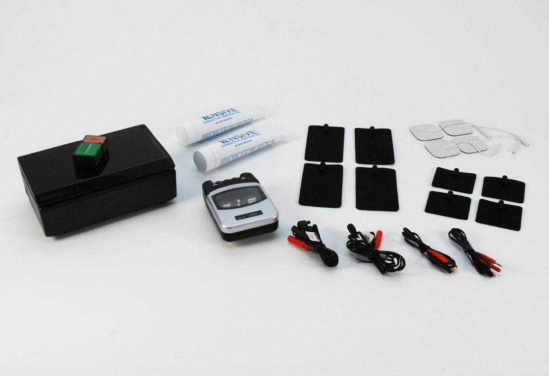 Promed TENS 1000s - here with electrodes, cables, electrode gel and charger