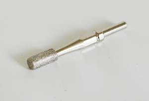 Cylinder shaped bit to use on toe nails together with Medisana hand and foot care devices
